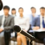 business woman speech speaking microphone audience