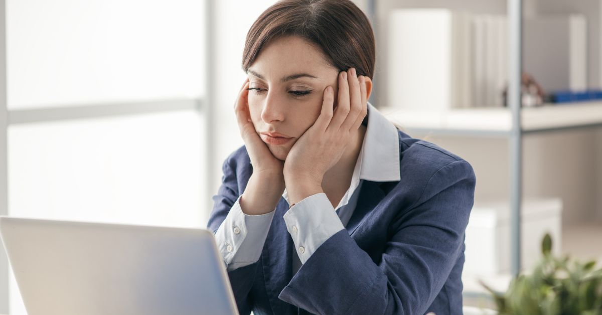 businesswomen unhappy at desk